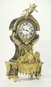 J. Paul Getty Museum: Wall Clock; Attributed to André-Charles Boulle (French, 1642 - 1732, master before 1666); Paris, France; about 1710; Gilt bronze; blue-painted horn; enameled metal.